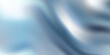 © Bardi Stock - Luxury liquid silver texture with smooth flowing waves. Metallic gradient on wavy curve surface. Glossy reflective mercury or chrome material. Silver material