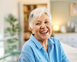© Lumos sp - Portrait of a happy senior elderly woman posing at home