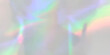 © sutthichai - Holographic silver texture background with vibrant rainbow neon light reflections. Iridescent metallic foil backdrop ideal for trendy futuristic and colorful modern graphic design