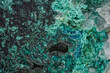 © Digital Photo - Green malachite porous formations on dark matrix with white quartz scientific microphotography, alternative crop view of mineral stone surface texture captured through microscope lens.