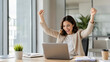 © Budi Jaya - Excited Office Worker Celebrating Online Success With Laptop