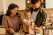 © La Famiglia - Happy family bonding, making dessert and having fun at home