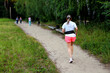 © Anton Belovodchenko - Adult European Woman Running in Open Stadium.
