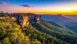 © Togar - Dramatic sunset illuminates the lush green valleys and rugged cliffs of a mountainous landscape.