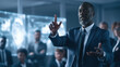 © AAA - Distinguished man gestures confidently in a modern boardroom
