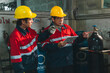 © chokniti - Worker helmet uniform factory cylinder safety inspection industrial engineer gas, two worker wearing yellow helmet and red uniform inspect gas cylinder in factory with focused expression
