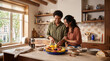 © AdPremium - Happy young couple preparing a healthy breakfast together with fresh tropical fruit in a bright, modern rustic kitchen during a sunny morning