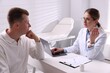 © New Africa - Man having appointment with gastroenterologist in clinic