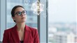 © joeycheung - Professional woman in red blazer gazes at floating geometric data structures.
