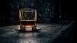 © Office - Glass of Amber Whiskey on a Stone Surface in Dim Lighting.