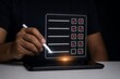© nupam - Person using a digital pen to interact with a holographic checklist on a tablet
