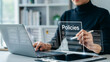 © ASHRAFUL - Business professional reviewing company policies on a digital transparent screen