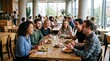© Anjaم  - Diverse colleagues enjoying lunch together in modern office cafeteria. Team of professionals bonding over casual midday meal in bright corporate di...