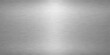 © NISAT AKTHER - Shiny brushed silver metal texture background with industrial polished steel plate pattern and metallic gray aluminum sheet surface backdrop