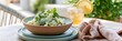 © Мария Фадеева - Creamy pasta salad with herbs and iced lemon tea on a balcony table for light summer lunch background and casual dining banner