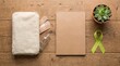 © ArifRus - Mental health awareness concept with a green ribbon and notebook on a wooden table.