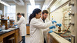 © Nei Mar - Students experimenting together in university laboratory with equipment