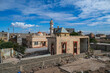 © robertharding - War damaged buildings near lighthouse in Benghazi depict the effects of conflict in Libya's urban landscape