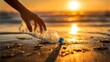 © 锴 张 - Hand reaching to collect discarded plastic water bottle from wet sandy beach at sunset with ocean waves golden sunlight, highlighting cleanup, recycling, pollution awareness environmental protection