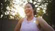 © ChayTee - Asia young Gen Z people mindful happy woman open arm relax body deep stress relief outdoor nature green public park sun light self love anti aging life asian female mental health care modern medical.