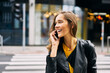 © Westend61 - Laughing woman on the phone