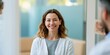 © perfectlab - Smiling female dentist in clinic