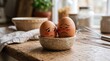 © Ambarbintu - Two Embarrassed Brown Eggs with Blushing Red Cheeks Sitting in Small Ceramic Bowl