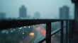 © Leonardo - Primer plano de gotas de lluvia adheridas a la barandilla metálica de un balcón