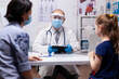 © DC Studio - Doctor writing child diagnosis on tablet showing practitioner specialist in medicine providing health care services in new normal medical clinic.
