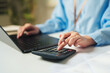 © Joi_studio - Financial analyst managing expenditures at a modern workspace, budget planning, corporate accounting, economic efficiency, and proactive fiscal strategy