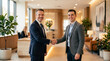 © Logo - Professional business handshake between two male executives in elegant modern hotel lobby.