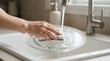 © SimpleDesignStudio - Person washing glass microwave turntable plate in kitchen sink, cleaning household appliance parts, daily chores and hygiene concept