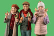© Pixel-Shot - Cute little happy kids in warm clothes with mushroom and autumn leaves on green background