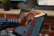 © DC Studio - Employee Placing Reminder Notes on Laptop Screen in a company office, using adhesive notes on a laptop screen to organize schedule, presentation tasks and reminders.