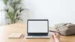 © velikiyzayats - Person holding credit card for online shopping on laptop with blank screen on wooden desk, e-commerce payment concept, remote work setup with notebook and backpack