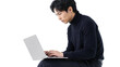 © amusto - Focused Young Asian Businessman Working on Laptop Computer Isolated on Transparent Background