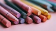 © Shahrul - Vibrant assortment of colorful chalk sticks arranged on a pink surface, showcasing artistic potential for creativity and playfulness in various projects.
