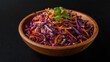 © LimeSky - Red cabbage and carrot coleslaw on a dark backdrop.