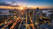 © soem - A stunning aerial photograph captures a sprawling cityscape at twilight. The image showcases Miami, Florida, with its iconic skyscrapers illuminated against a vibrant sky.