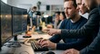 © Wiwis - Team of software developers working on code at office workstation