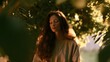© decorator - Serene woman bathed in golden light finds peace amidst lush foliage a tranquil portrait