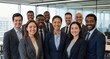 © Konstantin - Diverse business team smiling at camera, showing professionalism and teamwork in a modern office workplace setting
