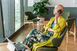 © Luis Velasco/Stocksy - Woman Talking on the Phone in a Modern Office Setting During Daytime