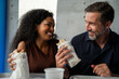 © Nenad - diverse couple, or woman and guy friends, each eating mexican tacos with appetite closeup, enjoying the food, looking happy, tex mex restaurant ad poster or social media post