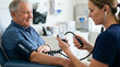 © Mala - Male patient getting blood pressure measured by nurse in clinic