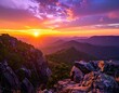 © Ballo - Majestic sunset paints the sky in vibrant hues over a mountainous landscape.
