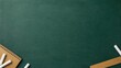 © Viktoryia - empty green chalkboard with spiral notebook, white chalk and wooden ruler arranged in bottom corners