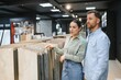 © Serhii - Couple choosing ceramic tiles in a bathroom furniture store