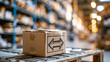 © Kateryna - Cardboard box marked with a bold return arrow standing on a clean pallet in a bright product warehouse with tall organized shelves returns handling concept reverse logistics