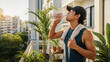 © Angel - Runner Drinking Water After Morning Exercise on Summer Balcony